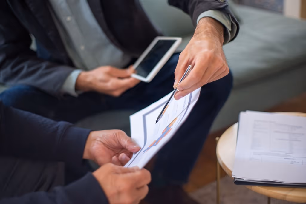 Advisor reviewing paperwork with a client